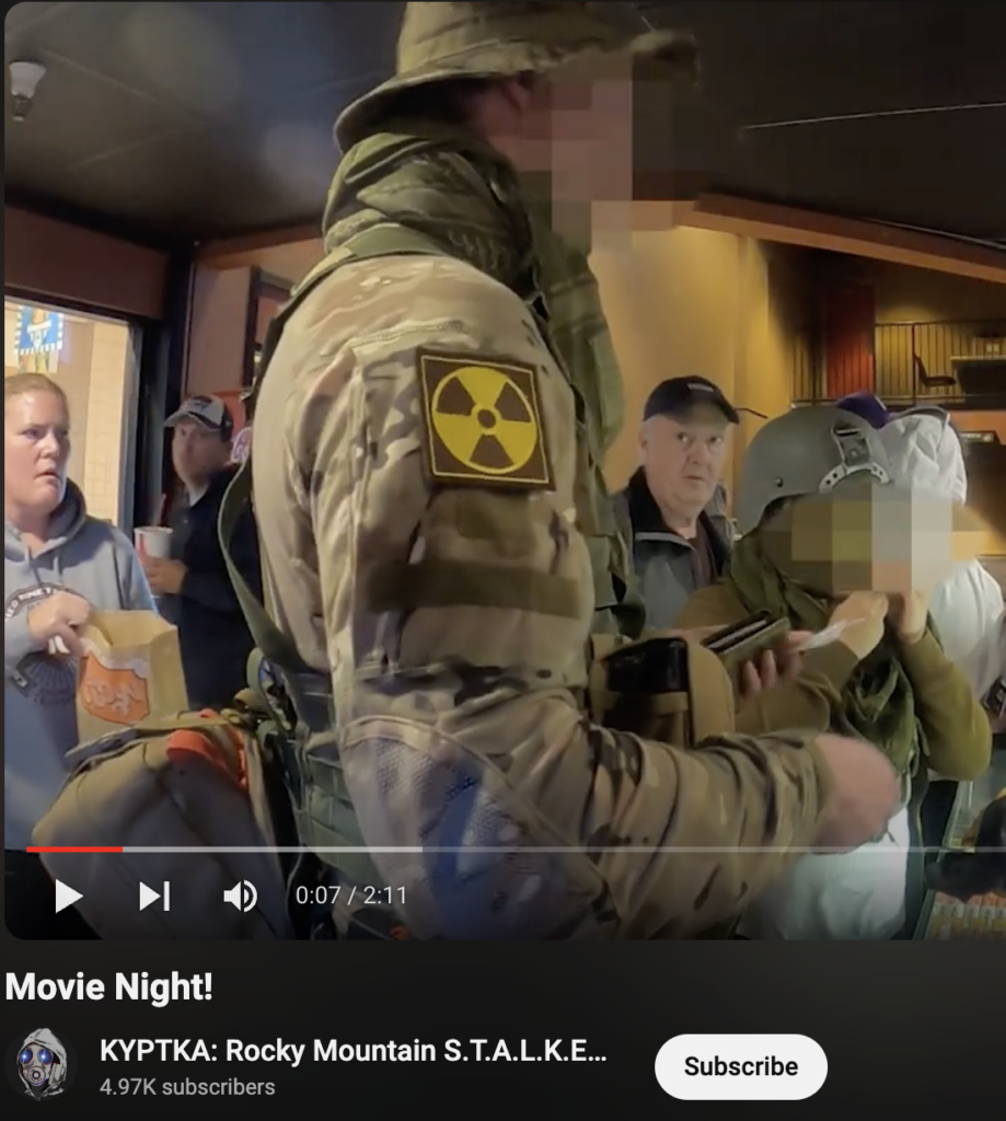 Trenin Bayless and his wife going to the movie theater dressed in fully military kit